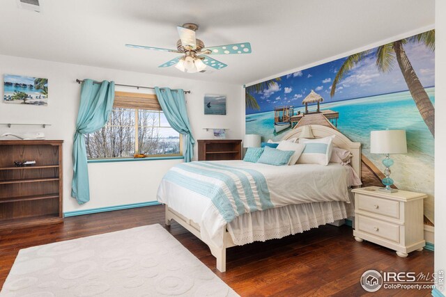 bedroom featuring ceiling fan and dark hardwood / wood-style floors