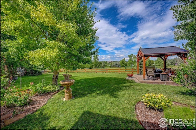 view of yard with a gazebo and a patio