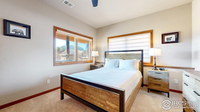 carpeted bedroom featuring ceiling fan