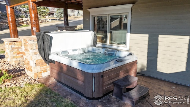 view of patio with a hot tub