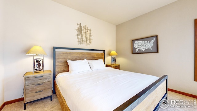 bedroom featuring light colored carpet