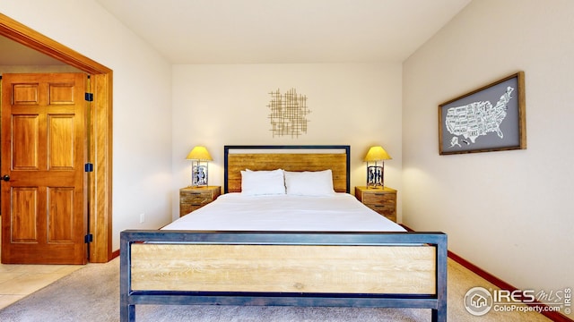 bedroom featuring light colored carpet