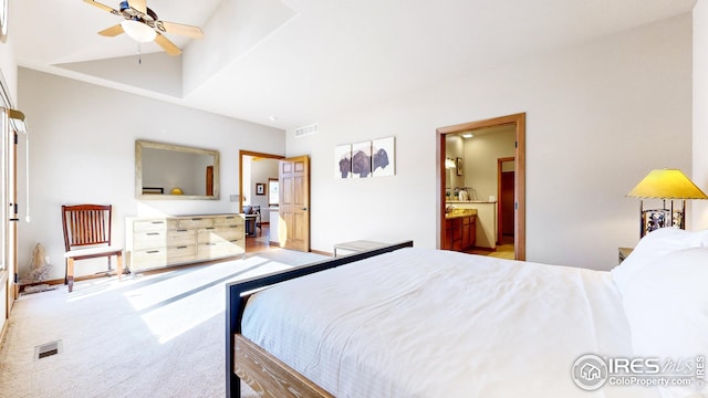 bedroom featuring ensuite bath, ceiling fan, and light colored carpet