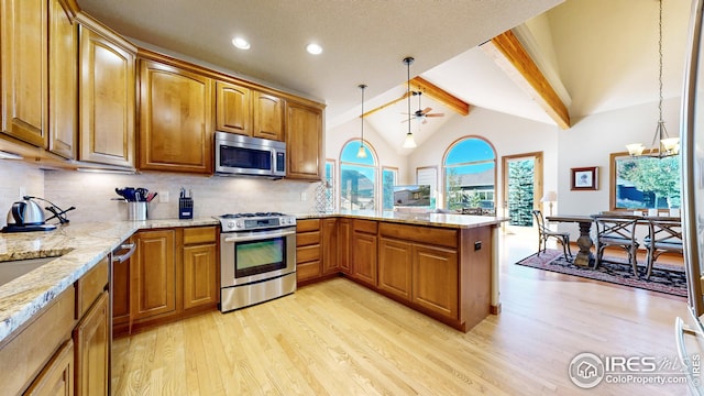 kitchen with pendant lighting, light wood-type flooring, decorative backsplash, stainless steel appliances, and vaulted ceiling with beams