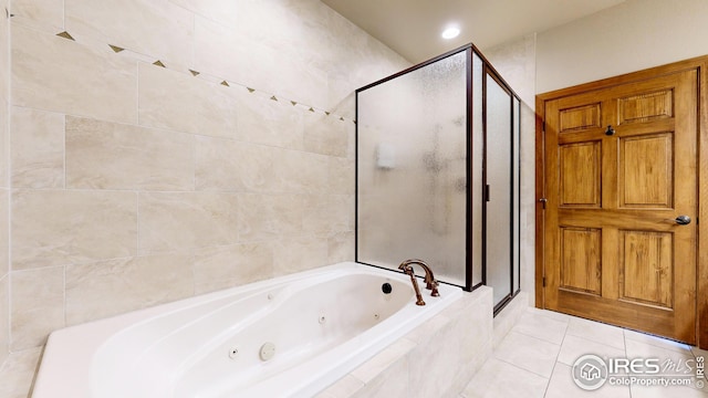 bathroom featuring plus walk in shower and tile patterned floors