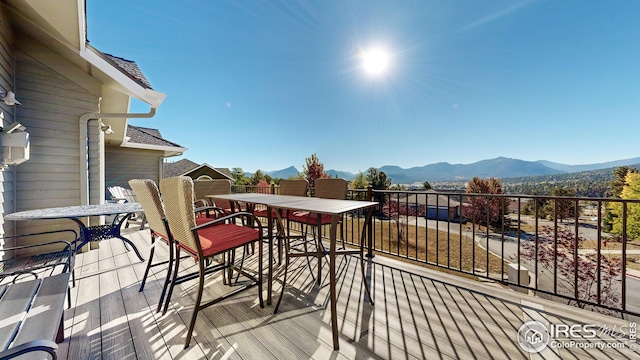 wooden terrace with a mountain view