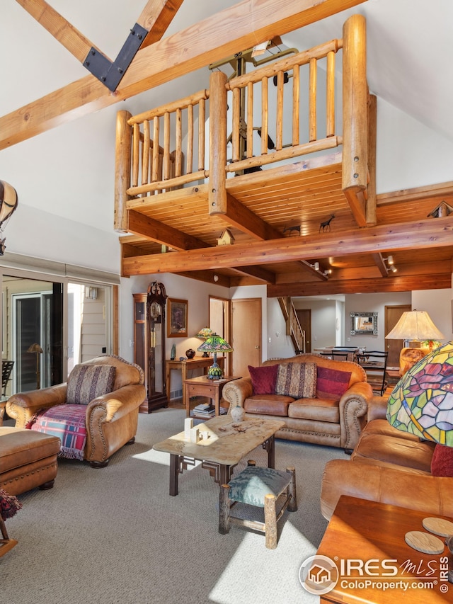 carpeted living room featuring beam ceiling and high vaulted ceiling