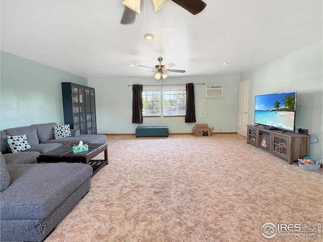 carpeted living room with ceiling fan and a wall mounted air conditioner