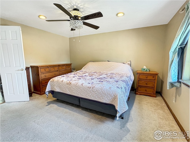 bedroom featuring ceiling fan and light colored carpet