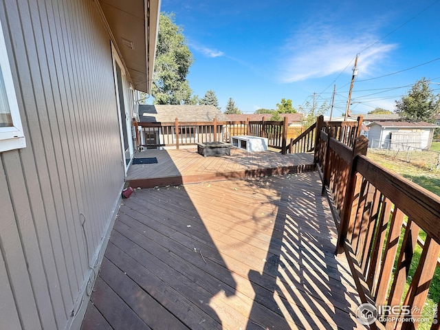 deck featuring a shed