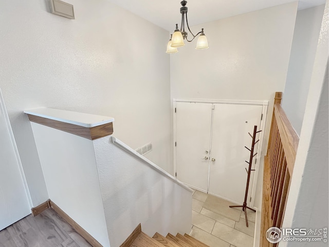 staircase featuring tile patterned floors