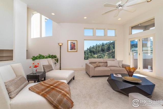 living area featuring carpet, ceiling fan, recessed lighting, and baseboards