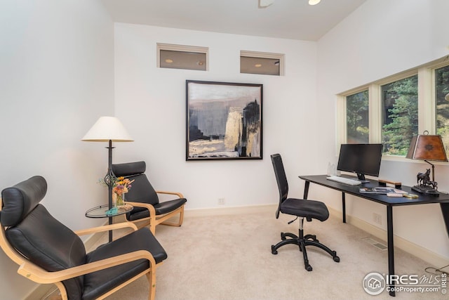 home office with visible vents, carpet, and baseboards