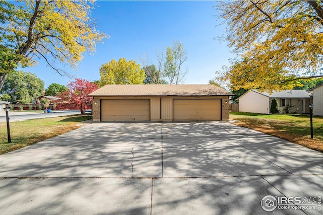 garage with a yard