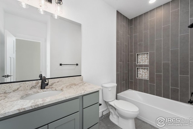 full bathroom featuring tub / shower combination, toilet, and vanity