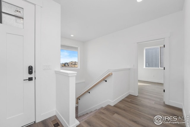 entryway featuring recessed lighting, visible vents, baseboards, and wood finished floors