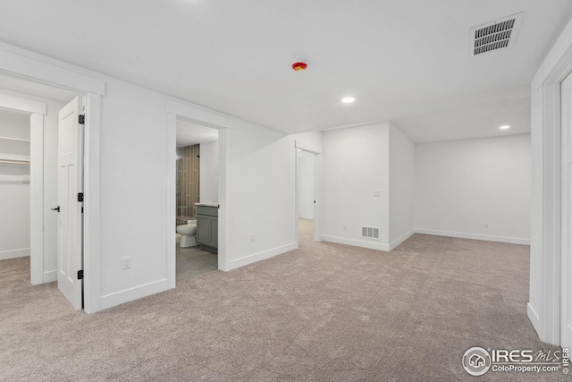 basement featuring recessed lighting, visible vents, baseboards, and carpet