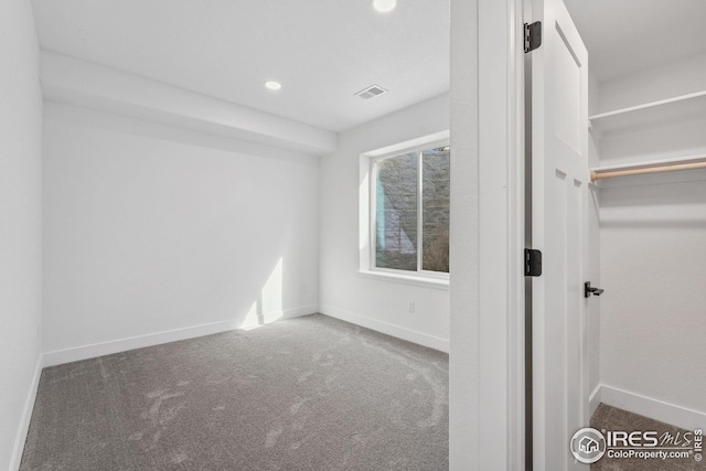 unfurnished bedroom with recessed lighting, carpet flooring, visible vents, and baseboards