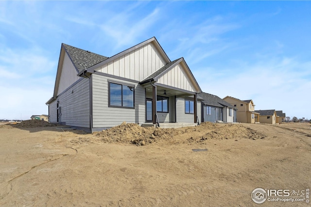 view of front of property with a porch, board and batten siding, and ceiling fan