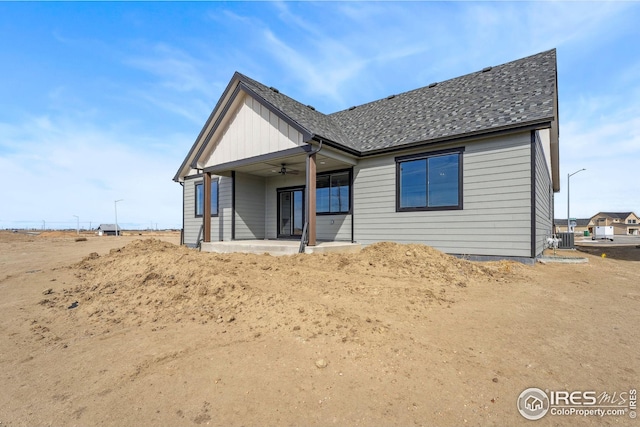 back of property featuring central air condition unit, a patio, a ceiling fan, and a shingled roof