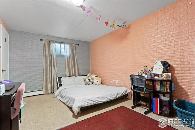 bedroom featuring light colored carpet, baseboard heating, and brick wall