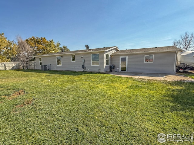 back of property with a patio, fence, cooling unit, and a yard