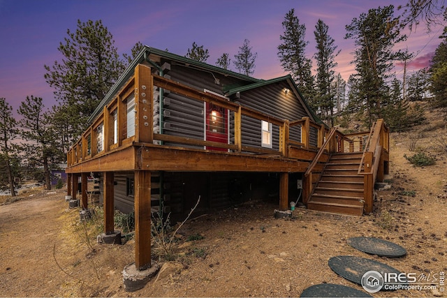 view of front of property featuring a wooden deck