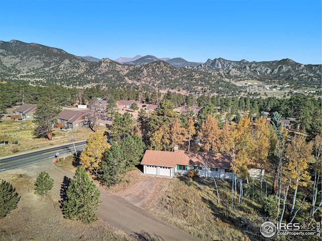 drone / aerial view featuring a mountain view