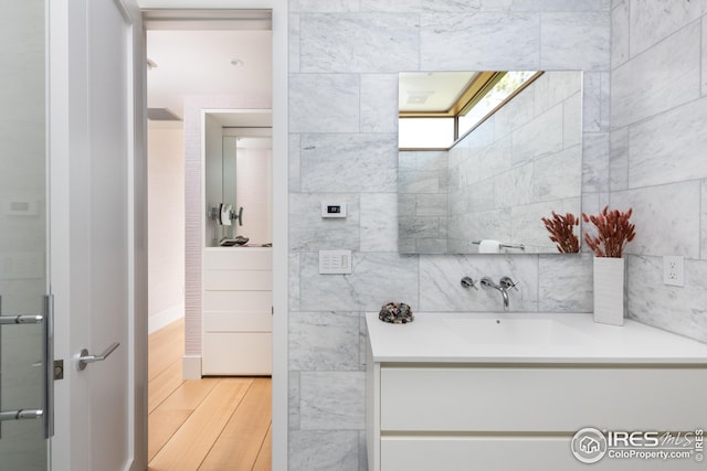 bathroom featuring hardwood / wood-style flooring and vanity