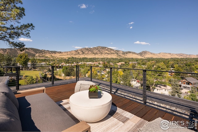 wooden terrace with a mountain view