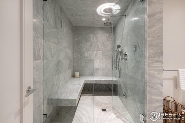 bathroom with tile patterned flooring and walk in shower