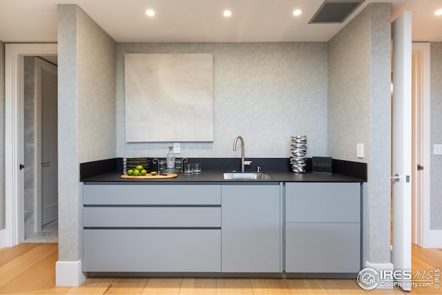 bathroom featuring wood-type flooring and vanity