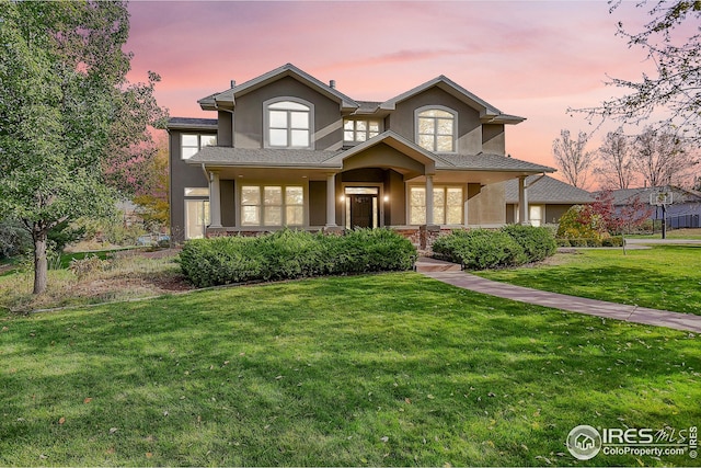 view of front of home featuring a lawn