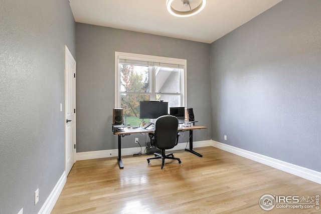 office with light hardwood / wood-style flooring