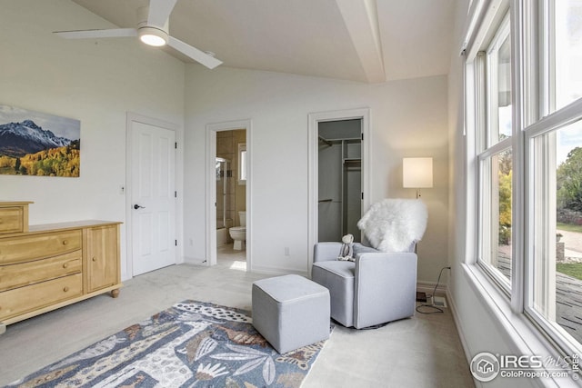 sitting room with light colored carpet, ceiling fan, and lofted ceiling