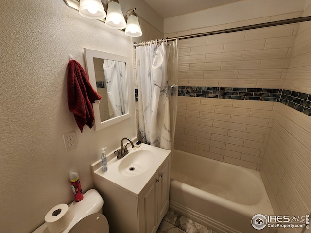 full bathroom featuring shower / tub combo with curtain, vanity, and toilet