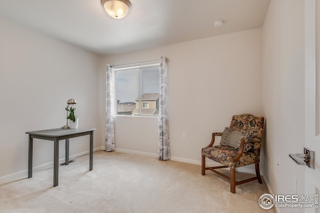 1135 Hummingbird Cir, Longmont, CO 80501 - sitting room with baseboards and light colored carpet