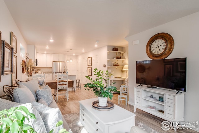 1135 Hummingbird Cir, Longmont, CO 80501 - living room with light wood-style flooring