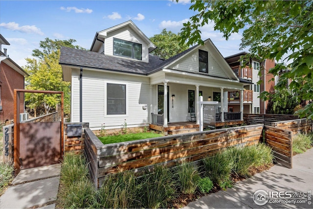 view of front of house featuring a balcony and a porch