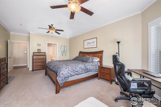 bedroom featuring ensuite bath, crown molding, and ceiling fan