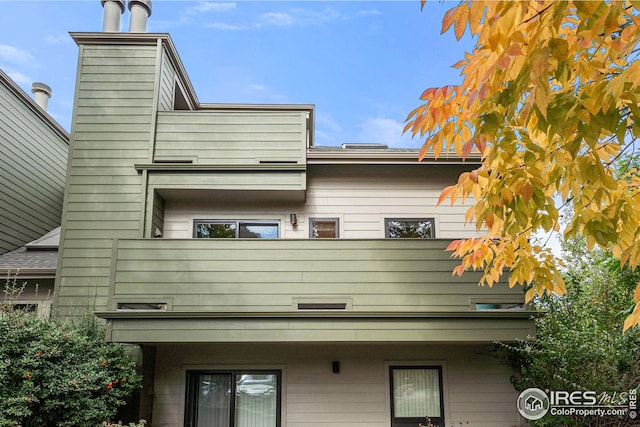 view of home's exterior with a balcony