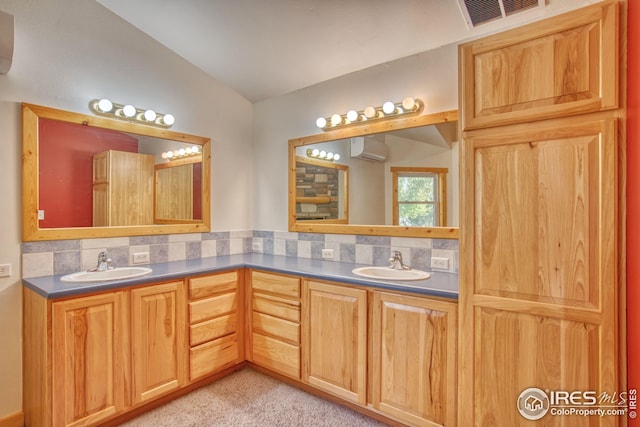 bathroom featuring vanity, a wall mounted AC, backsplash, and vaulted ceiling