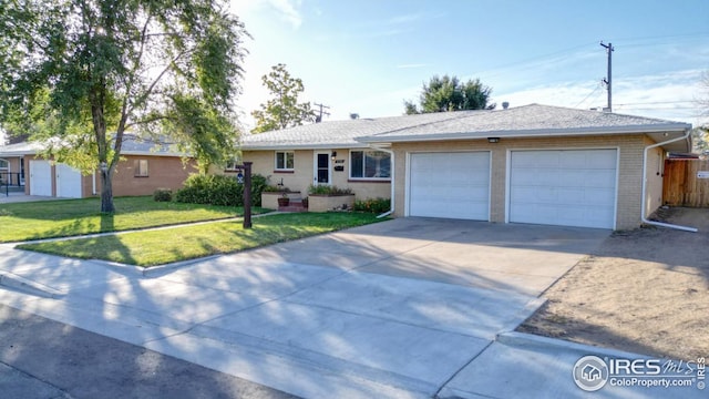 ranch-style house with a front lawn and a garage