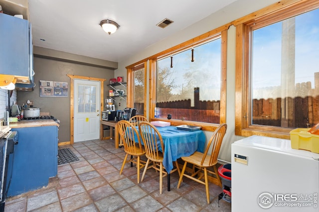 dining room featuring visible vents and stone finish floor