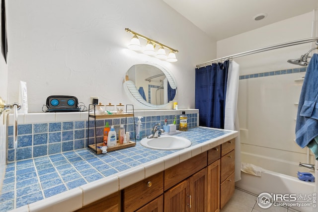 bathroom with tile patterned floors, vanity, tasteful backsplash, and shower / bath combination with curtain