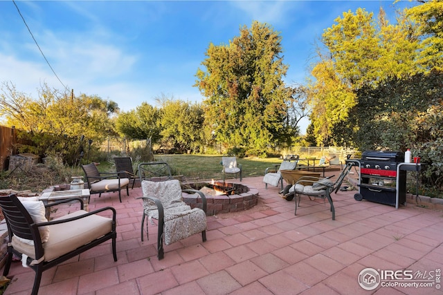 view of patio with a fire pit and grilling area