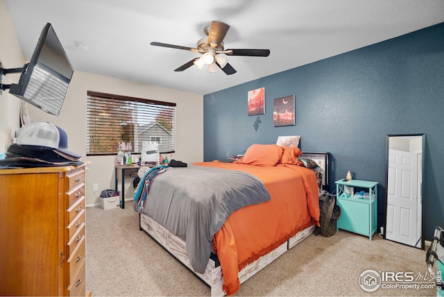 carpeted bedroom with ceiling fan