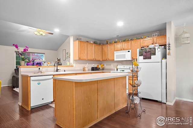 kitchen with lofted ceiling, dark hardwood / wood-style floors, a center island, white appliances, and ceiling fan