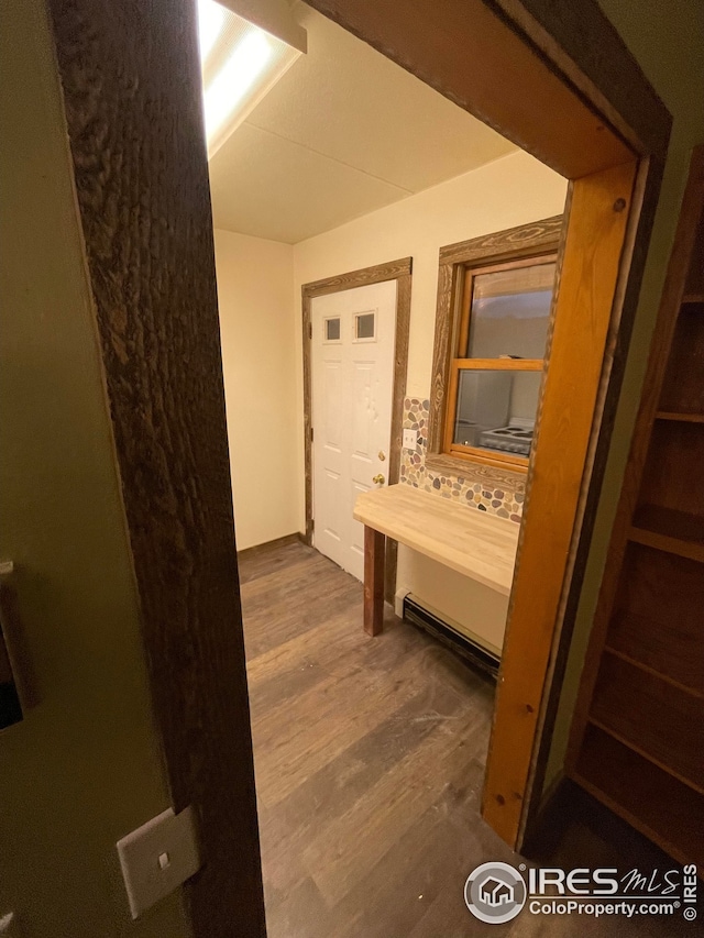 hallway featuring dark hardwood / wood-style floors