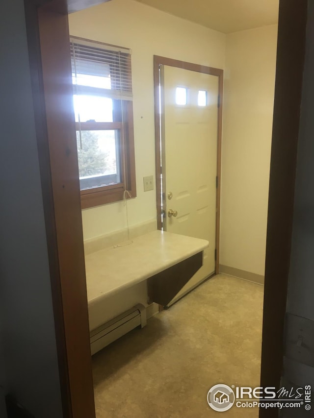 bathroom featuring a baseboard heating unit